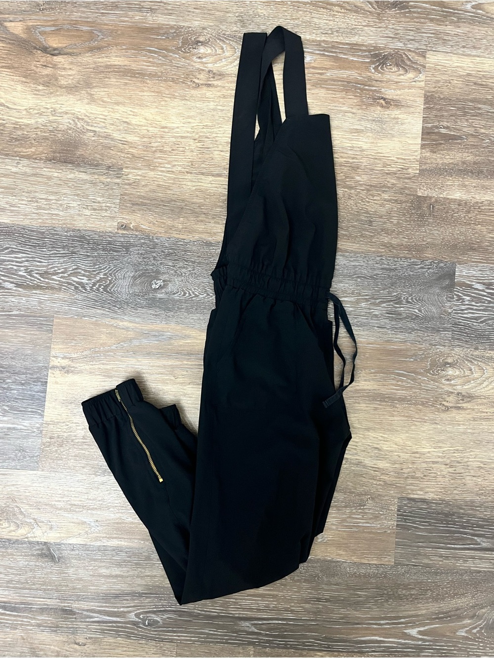 Albion Fit Black Sleeveless Jumpsuit with Elastic Waist and Zip Pocket